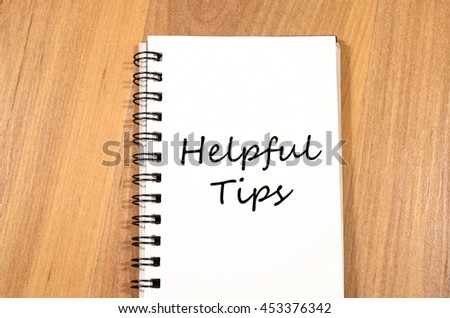 Helpful tips text concept write on notebook