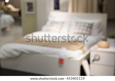blur bed room picture background  of furniture mall 
