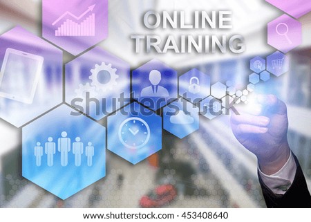 Businessman draws "Online Training" on the virtual screen. Business concept. Internet concept.