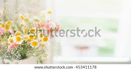 Pretty  daisies bunch at window, floral background