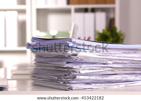 Office desk and a bundle of documents