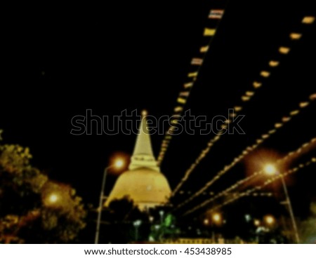 Blur picture and gold temple in the night time