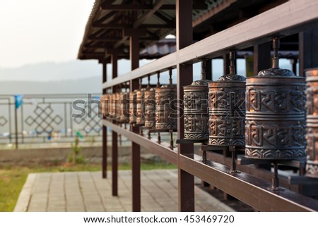 Religious prayer wheel for meditation in a Buddhist temple in Buryatia, Russia Ulan-Ude. Royalty-Free Stock Photo #453469720