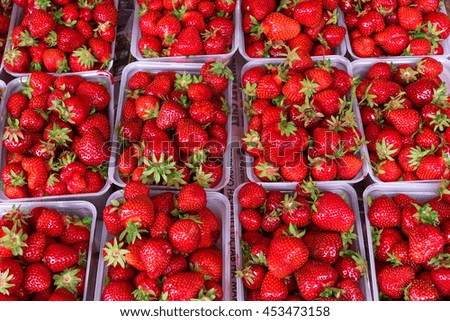 Natural strawberry in baskets on the market. High resolution product.