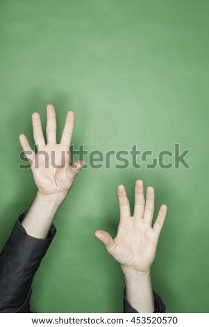 hand gesture of a male caucasian in a business suit: two hands reaching out for something