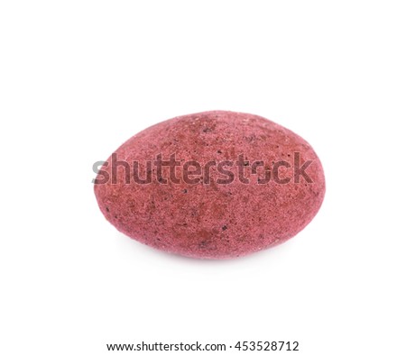 Almond nut coated with the red colored chocolate isolated over the white background