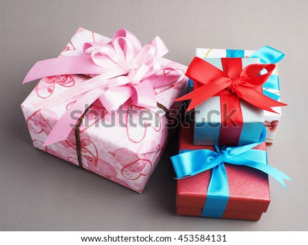 Colorful gift box in important day on gray background concept, top view.