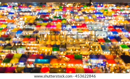 Blurred lights aerial view free market roof top, abstract background