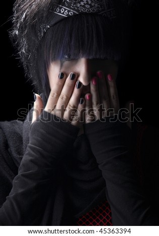 Depression of the young girl on a black background