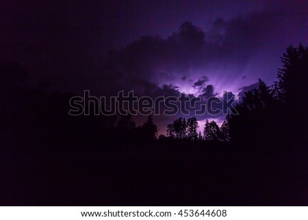 Landscape with lightning at stormy night. Dark night with lightning bolt - photo taken in Poland. 