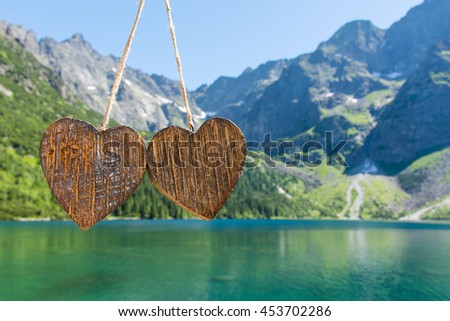 Two wooden heart on the background of the Mountain National Park in Poland Zakopane