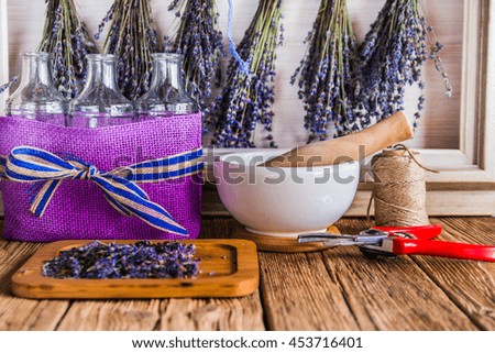 Bouquets of lavender while drying on wooden boards.