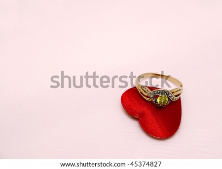 Golden ring with heart shape