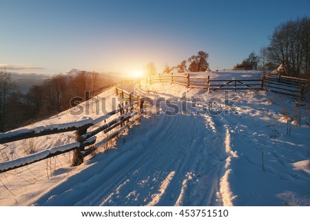 rural winter road covered by snow. natural background. vintage picture