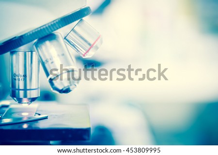 Laboratory Microscope. Scientific research background. Royalty-Free Stock Photo #453809995