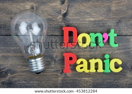 Don't panic word on wooden table