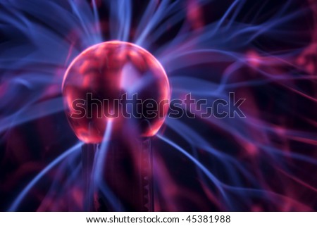 Closeup shot of a plasma ball with blue and pink blots