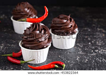 Chocolate cupcakes with red hot mexican chili pepper