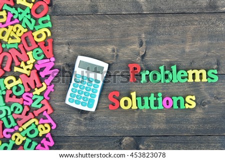 Problems and Solutions word on wooden table