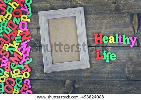Healthy life word on wooden table