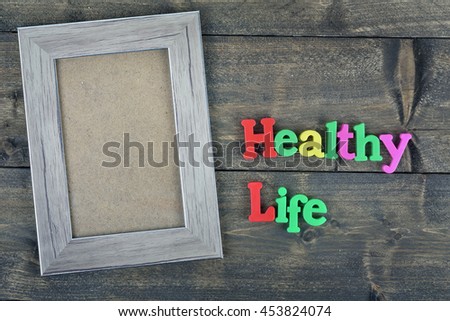 Healthy life word on wooden table