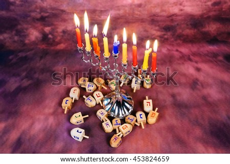 Jewish holiday Hanukkah creative background with menorah. View from above with focus on menorah. R
