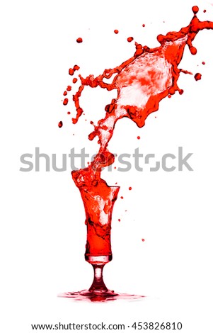 Red cocktail glass splash out on a white background. 
