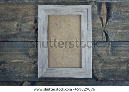 Empty photo frame word on wooden table