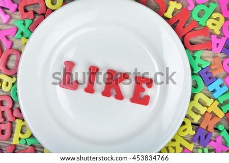 word on white plate and magnetic letters