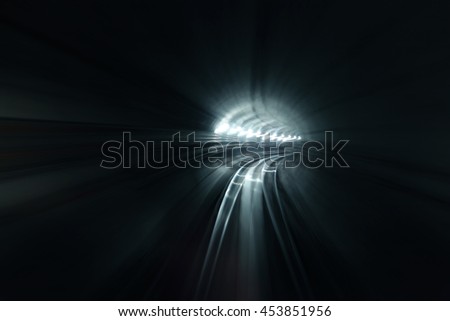 Light trail zooming through a tunnel.
 Royalty-Free Stock Photo #453851956