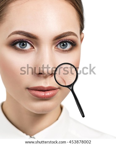 Eoman with magnifying glass showing aging skin