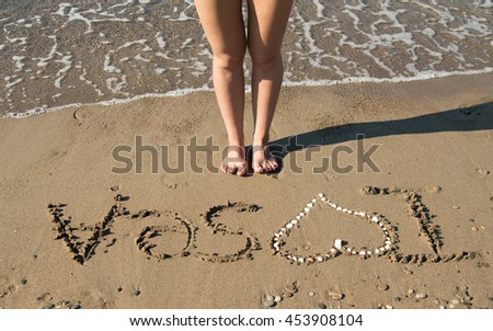 "I love the sea" the inscription on the sand