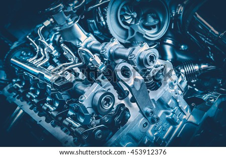 The powerful engine of a car. Internal design of engine. Car engine part. Modern powerful car engine. Royalty-Free Stock Photo #453912376