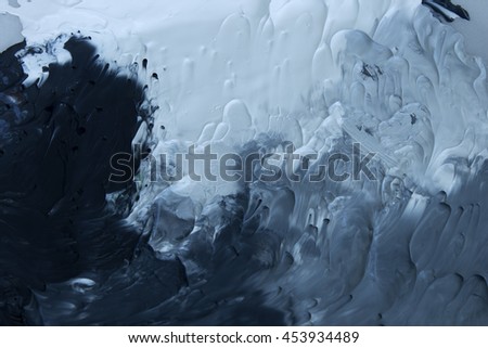 This is a photograph of Black,Grey and White acrylic paint background