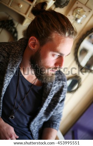 Above view of young Caucasian man indoor. Vintage space. 