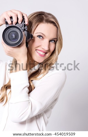 Woman photographer is all set to take your pic