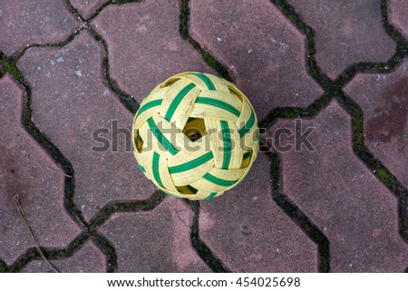 Rattan ball lying on a court in a gym