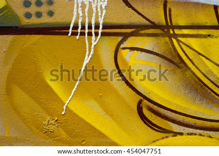 Fragment of the cement wall with graffiti. Abstract background