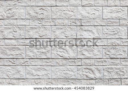 Wall of white bricks and large blocks