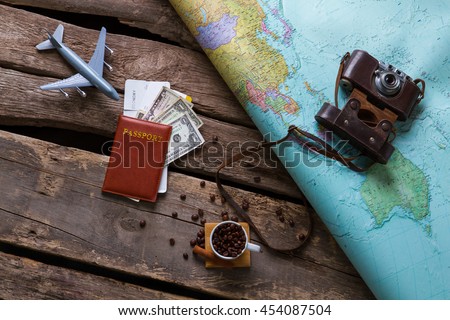 Passport with dollars near map. Coffee beans and photo camera. Why not take a trip. Your possibilities are limitless.