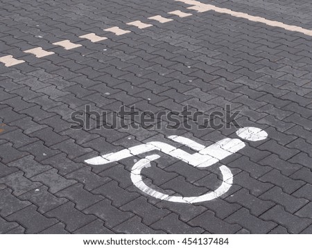 parking space with a sign for wheelchair user