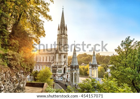 Rosary Basilica on sunset in Lourdes, Hautes-Pyrenees, France Royalty-Free Stock Photo #454157071