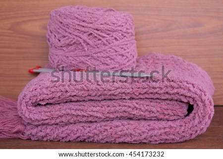 balls of yarn and knitting needles on knitting 