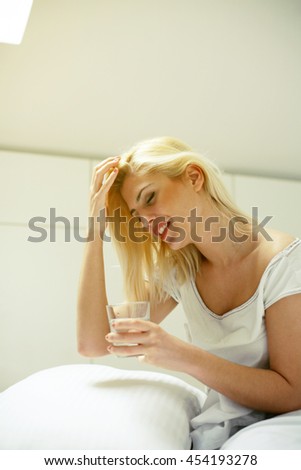 Woman having headache in the morning. 