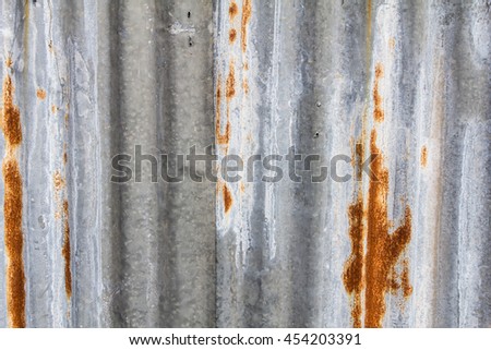 Rusty tin metal fence.