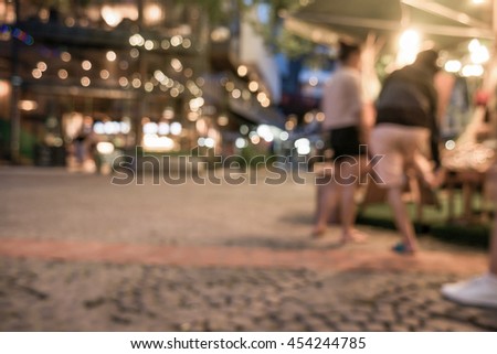 Blurred image of night street market, split retro tone color effected
