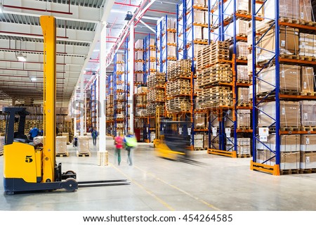 Interior of a modern warehouse in time with the staff Royalty-Free Stock Photo #454264585