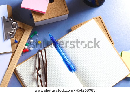 Desk of an artist with lots of stationery objects