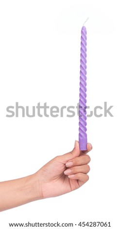 hand holding purple candles isolated on white background