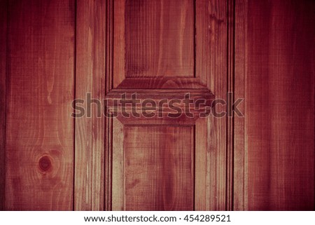 Fragment of new painted wooden door. Toned.